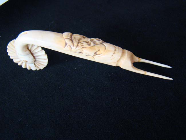 A patriotic motif sailor carved ivory Pie Crimper with a bust of 'Lady Liberty' circa 1875